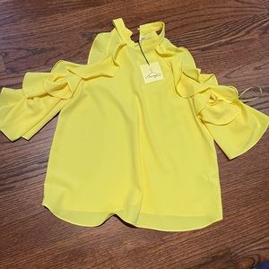 New yellow blouse with cut outs on sleeves.